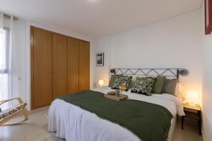 En eller flere senge i et værelse på Dorm4You Patacona