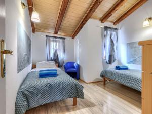 Łóżko lub łóżka w pokoju w obiekcie Holiday Home Rotonda by Interhome