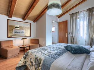 Łóżko lub łóżka w pokoju w obiekcie Holiday Home Rotonda by Interhome
