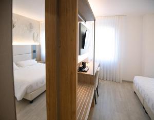Postel nebo postele na pokoji v ubytování Hotel Everest
