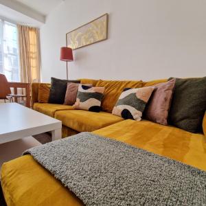 a living room with a couch and a table at 2-Bed Apartment I Hyde Park I Central London in London