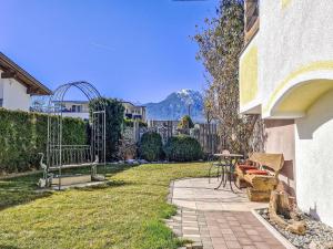 a patio with a table and chairs in a yard at Apartment Helga by Interhome in Karres