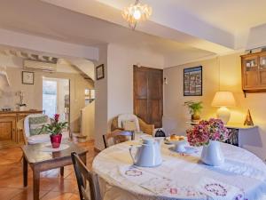 a kitchen and living room with a table and chairs at Holiday Home Côté Place by Interhome in Villars