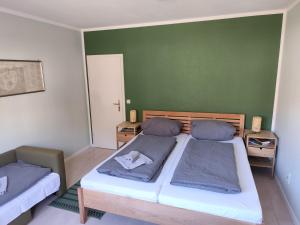 Ένα ή περισσότερα κρεβάτια σε δωμάτιο στο Apartment Wolkenhügel +4 φωτογραφίες