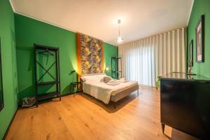 Postel nebo postele na pokoji v ubytování Dei Balzi apartments