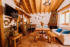 a living room with a table and a couch at Casas Rurales Nerpio Villa Turrilla in Nerpio