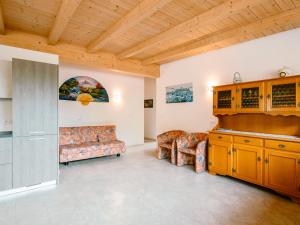 a living room with a couch and a table at Apartment Ciampedie by Interhome in Pera