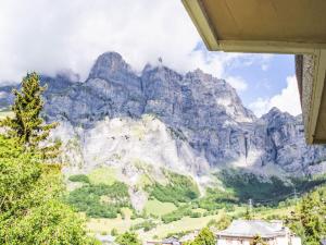a mountain view from a room with a window at Apartment Flaminia 39 by Interhome in Leukerbad