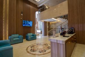TV a/nebo společenská místnost v ubytování فندق نيوليفيل - New Level Hotel + 37 fotografií