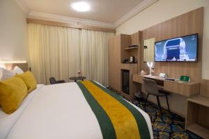 TV a/nebo společenská místnost v ubytování فندق نيوليفيل - New Level Hotel