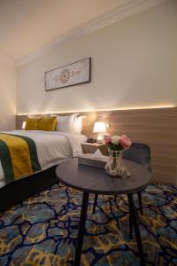 Postel nebo postele na pokoji v ubytování فندق نيوليفيل - New Level Hotel