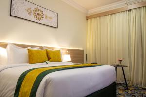 Postel nebo postele na pokoji v ubytování فندق نيوليفيل - New Level Hotel