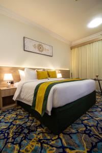 Postel nebo postele na pokoji v ubytování فندق نيوليفيل - New Level Hotel