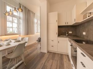 Kuchyň nebo kuchyňský kout v ubytování Villa Metropol - Ferienappartement Sabei