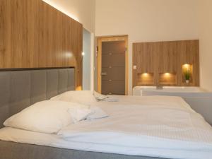 Postel nebo postele na pokoji v ubytování Villa Metropol - Ferienappartement Sabei