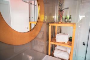 a bathroom with a large mirror and a sink at Casa San Roque in Seville +63 photos