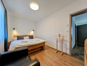Posteľ alebo postele v izbe v ubytovaní Rodinné apartmány Dobrné