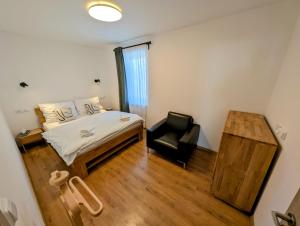 Posteľ alebo postele v izbe v ubytovaní Rodinné apartmány Dobrné