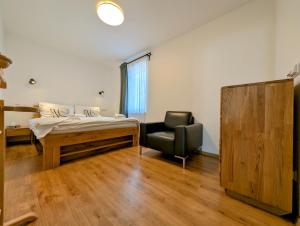 Posteľ alebo postele v izbe v ubytovaní Rodinné apartmány Dobrné