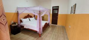 Krevet ili kreveti u jedinici u okviru objekta Kamengo Cottages