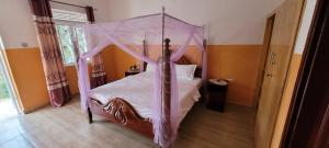 Krevet ili kreveti u jedinici u okviru objekta Kamengo Cottages