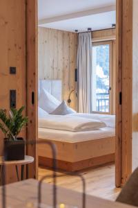 Ένα ή περισσότερα κρεβάτια σε δωμάτιο στο Apartment Mountain Suite Nr 102 by Interhome