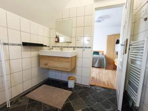 a bathroom with a sink and a mirror at Ubytování Pohoda in Třeboň +21 photos