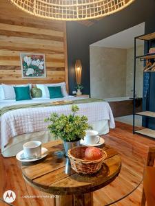 a bedroom with a bed and a table with a bowl of fruit at La Hijuela in El manzano historico