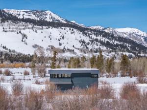 a building with the words we are here on it in the snow at Secluded Mountain View Getaway - Near Jackson Hole - BBQ, Patio Wildlife! in Wilson