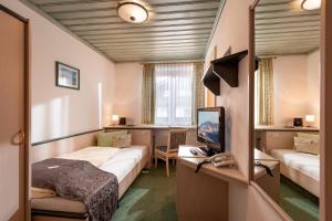 Postel nebo postele na pokoji v ubytování Pension Garni Appartement Ortner