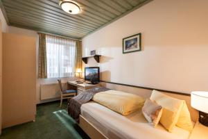 Postel nebo postele na pokoji v ubytování Pension Garni Appartement Ortner