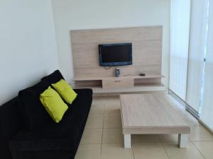 Un televizor și/sau centru de divertisment la Relax Punta Centinela +5 fotografii