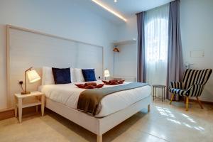 Katil atau katil-katil dalam bilik di Kirxa Rooms and Suites
