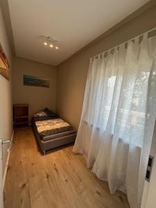 Ένα ή περισσότερα κρεβάτια σε δωμάτιο στο Beach Monteur Apartment +6 φωτογραφίες