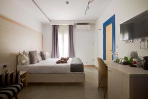 Katil atau katil-katil dalam bilik di Kirxa Rooms and Suites