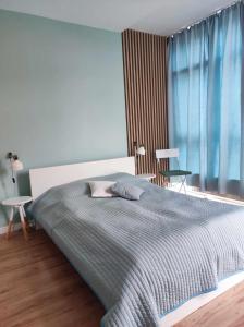 Posteľ alebo postele v izbe v ubytovaní APARTAMENT KOŁOBRZEG