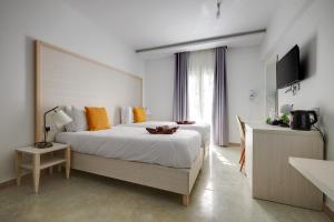 Katil atau katil-katil dalam bilik di Kirxa Rooms and Suites