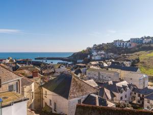 an aerial view of a town with the ocean at Holiday Home Lighthouse Watch by Interhome in Mevagissey
