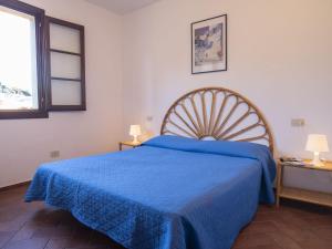 En eller flere senge i et værelse på Apartment Borgo Patresi-1 by Interhome