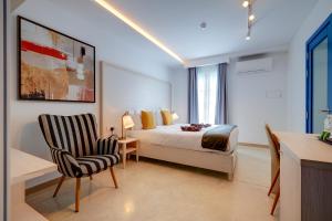 Postel nebo postele na pokoji v ubytování Kirxa Rooms and Suites