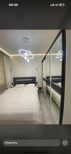 Ένα ή περισσότερα κρεβάτια σε δωμάτιο στο Коттедж