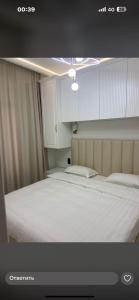 Ένα ή περισσότερα κρεβάτια σε δωμάτιο στο Коттедж