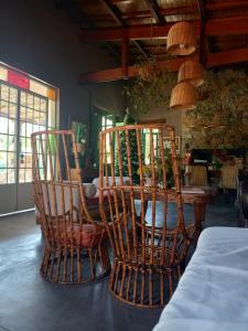 a dining room with two chairs and a table at El rancho de Ana in Colonia Las Rosas