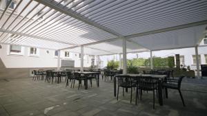 Reštaurácia alebo iné gastronomické zariadenie v ubytovaní Franko hotel