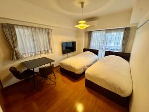 Postelja oz. postelje v sobi nastanitve Monica ONE 302号室名古屋駅前
