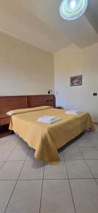 Postel nebo postele na pokoji v ubytování Hotel Ristorante La Decanata