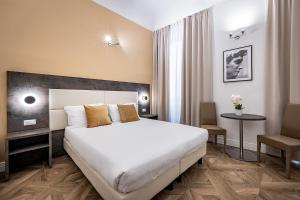 Posteľ alebo postele v izbe v ubytovaní B&B De Biffi