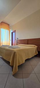 Postel nebo postele na pokoji v ubytování Hotel Ristorante La Decanata