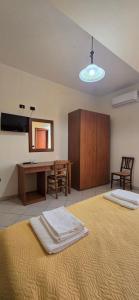 Postel nebo postele na pokoji v ubytování Hotel Ristorante La Decanata