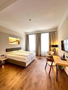Postel nebo postele na pokoji v ubytování Hotel Rathaus - Wein & Design